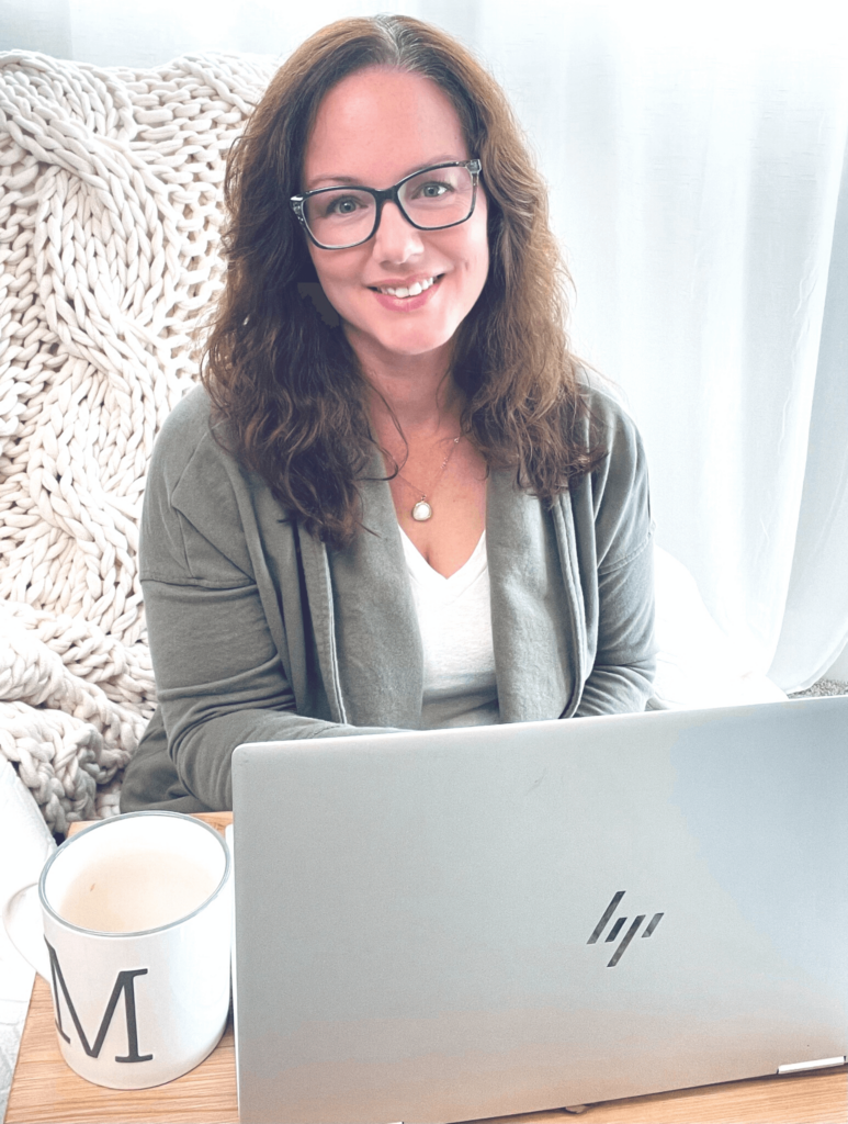 Melissa Ann Chavis sitting in front of a laptop